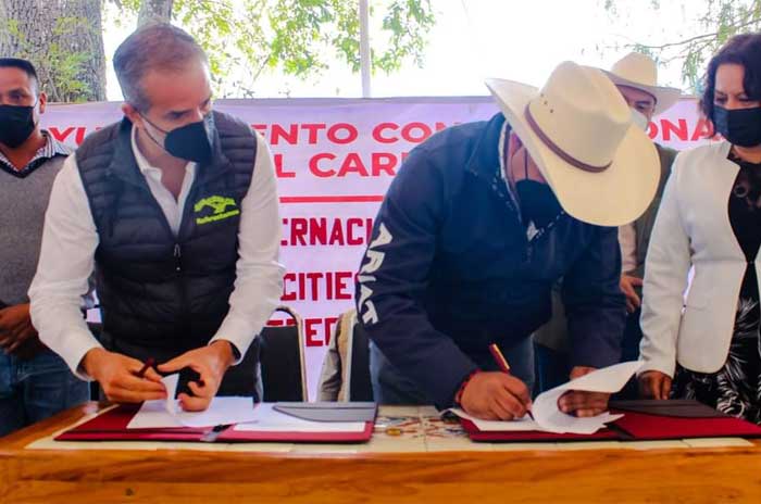 firma convenio villa del carbon