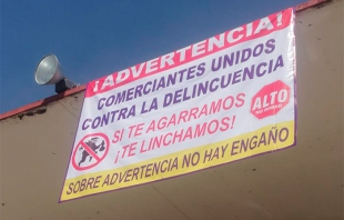 #Toluca: Comerciantes del mercado Juárez colocan mantas para intentar alejar a rateros