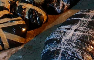 Dejan aparentes restos humanos en bolsas negras en Tultitlán